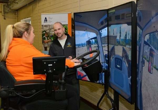 Enda Kennedy, Assistant Principal at Mountbellew Agricultural College, County Galway, Ireland is pictured assisting prospective students on the tractor simulator at the recent college open day.